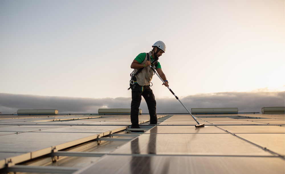 Cleaning solar panels on roof