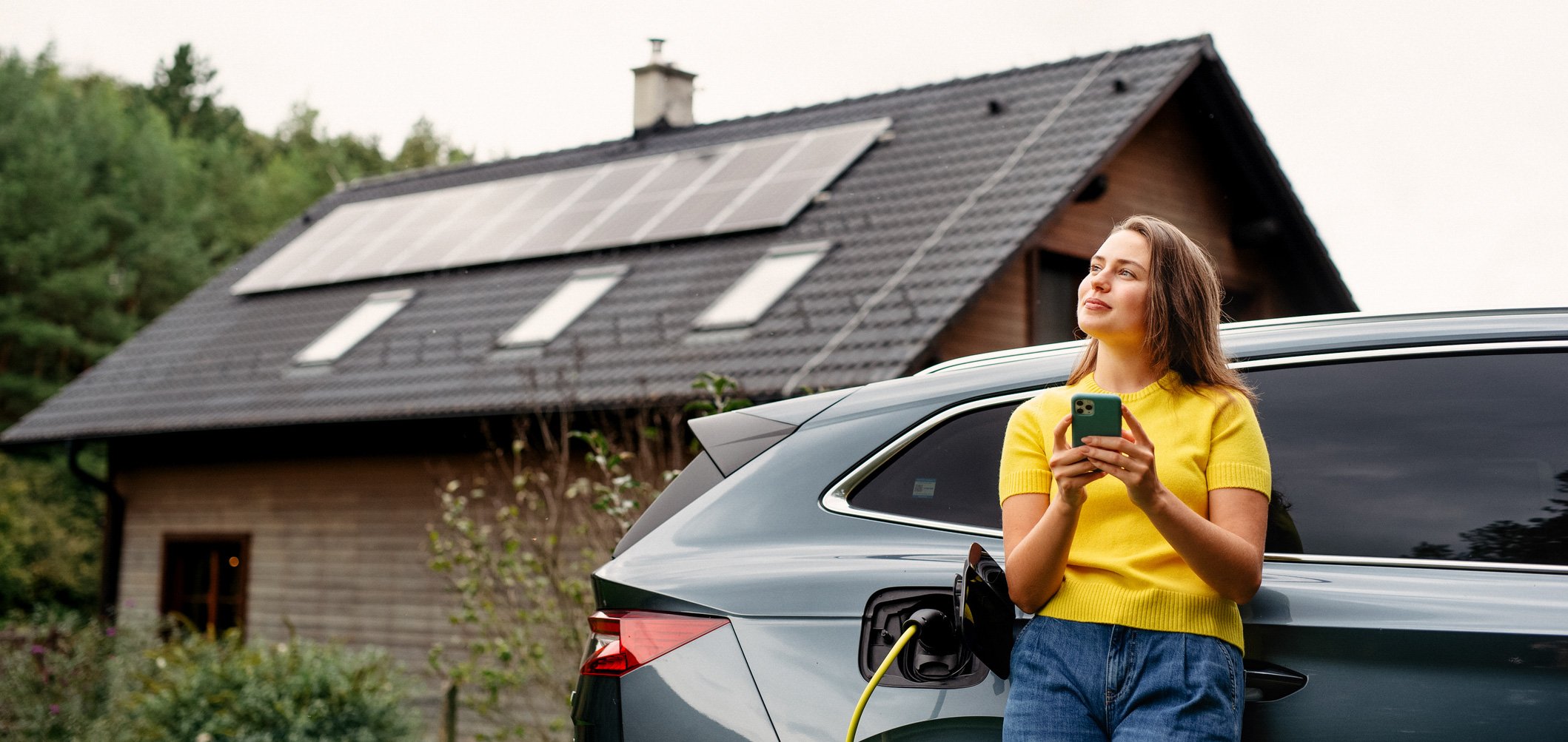 Woman with EV and solar